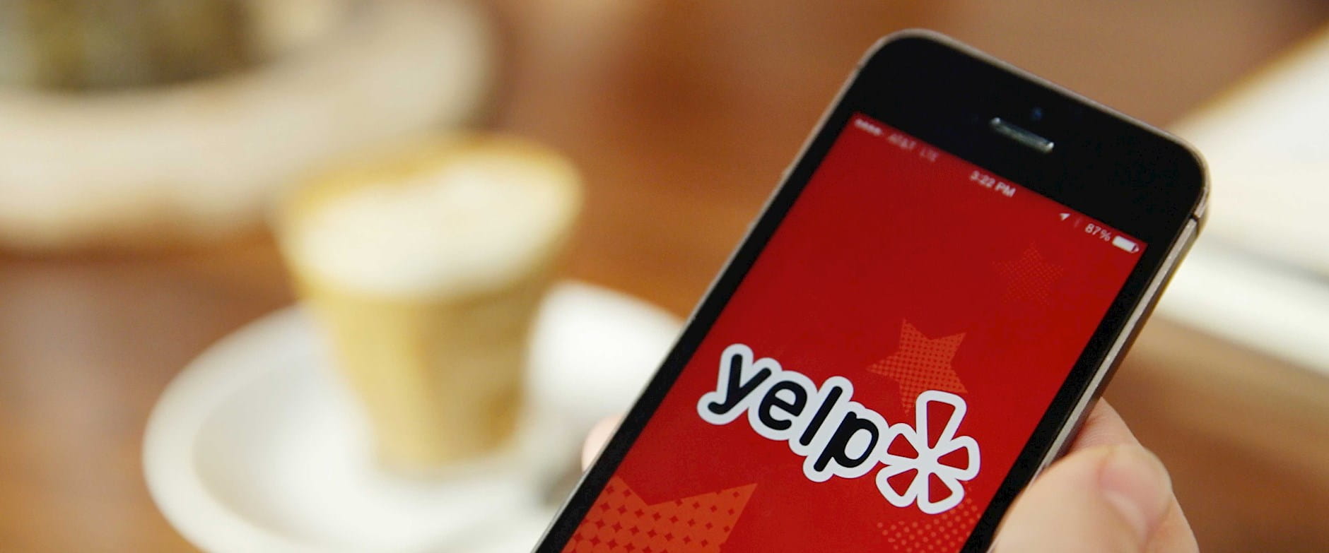 Smartphone with Yelp app open