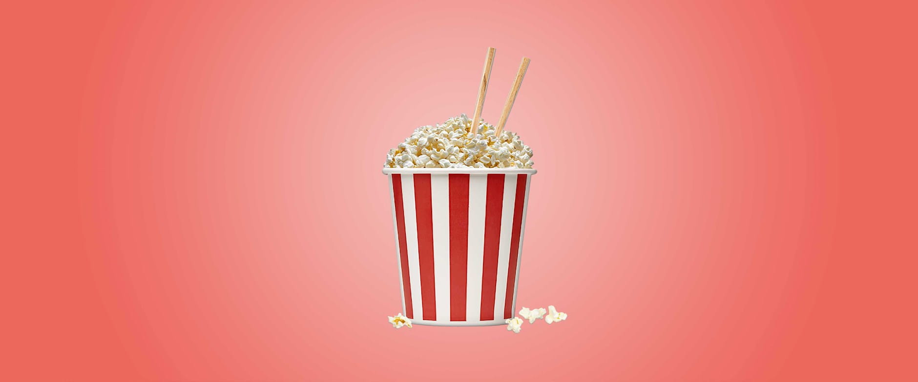 Popcorn in bucket with chopsticks