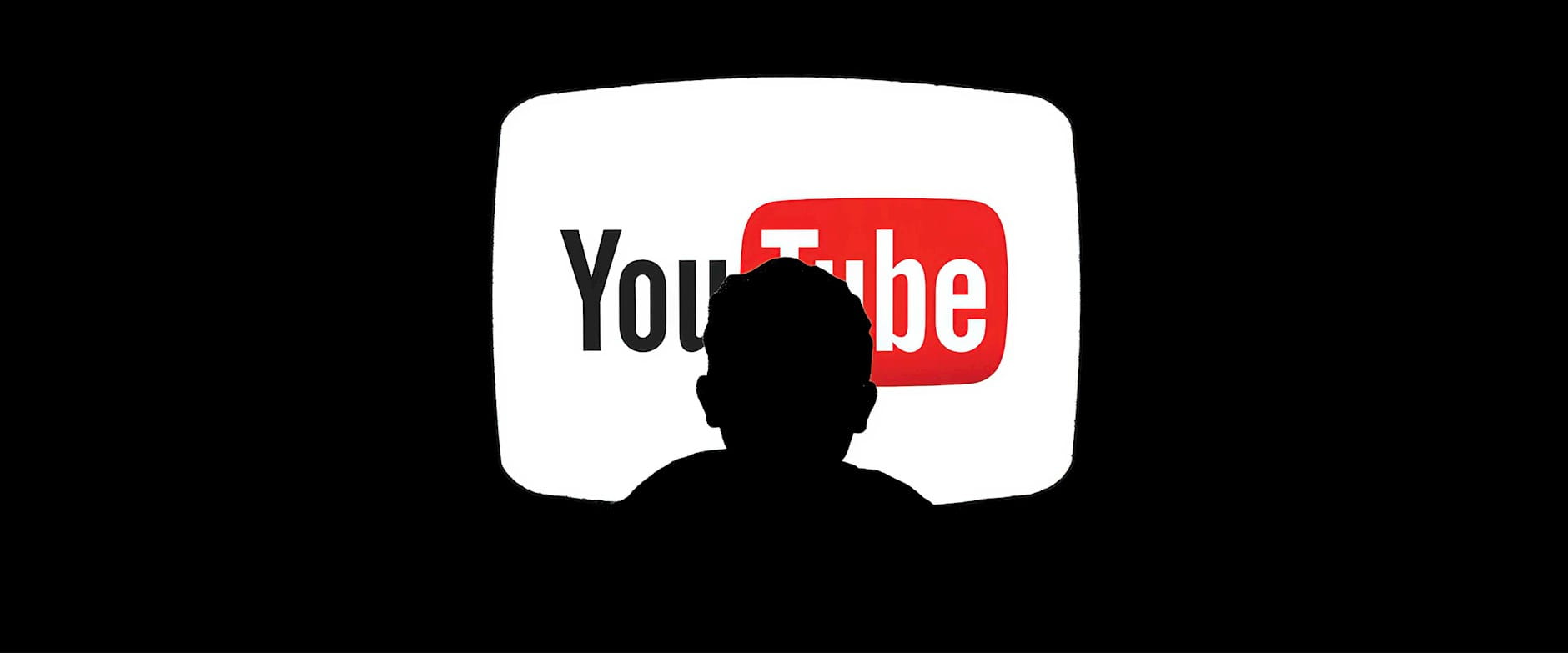 Silhouette of person in front of YouTube