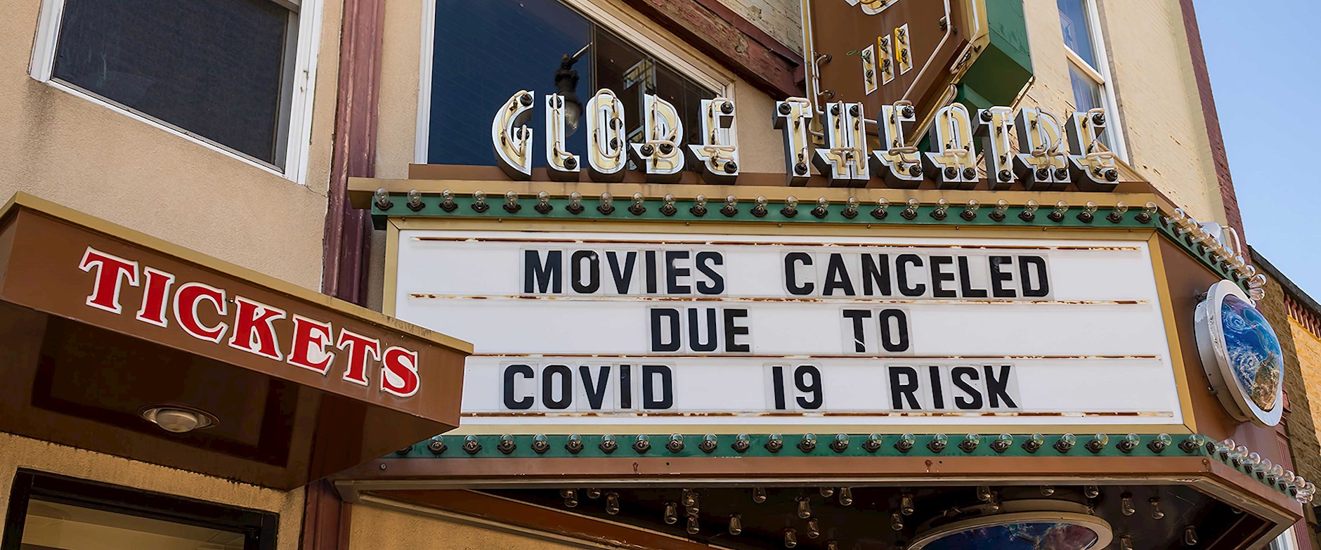 Movie marquee that says "Movies cancelled due to covid 19 risk"